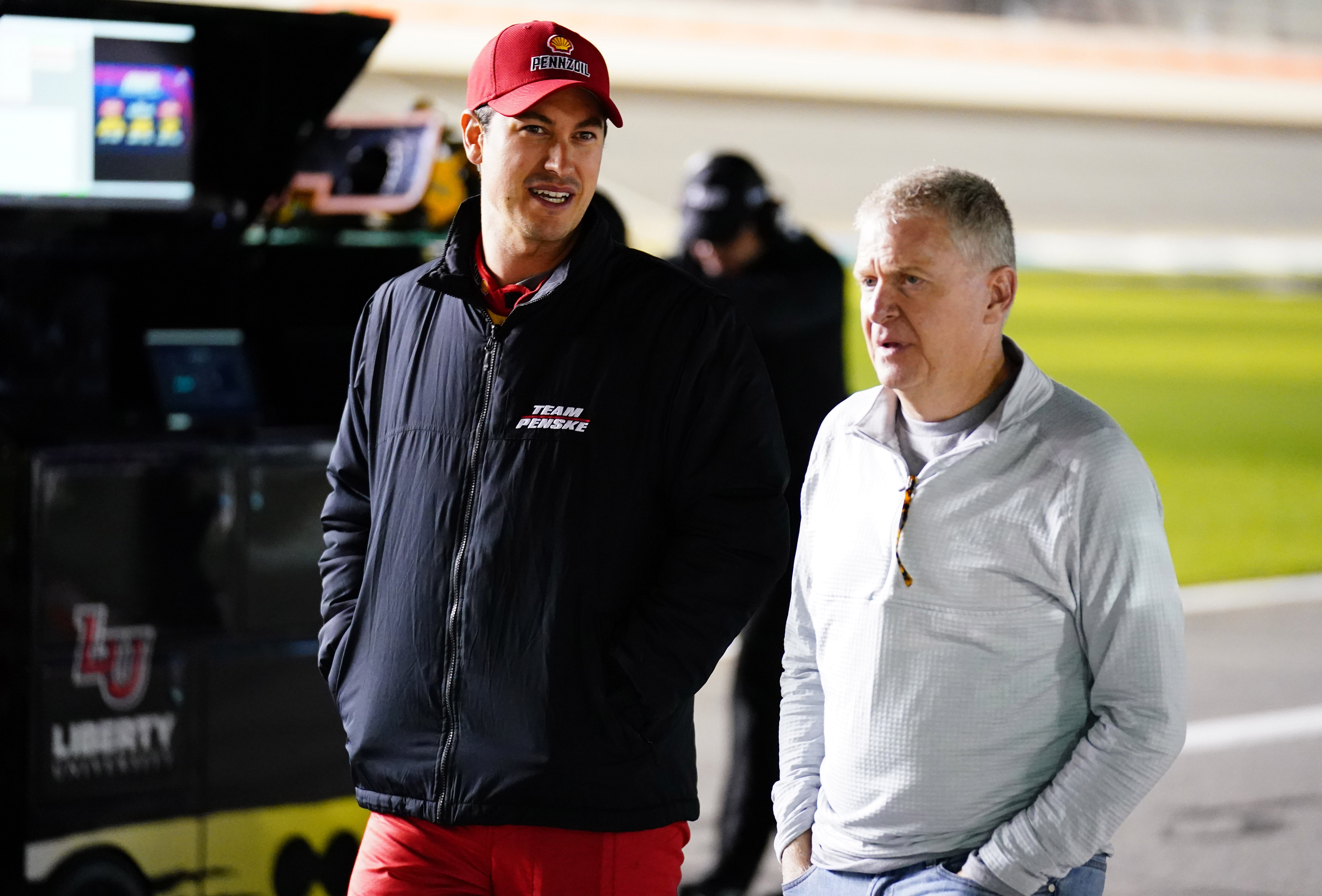 Joey Logano and Jeff Burton walking together at Daytona - Source: Imagn